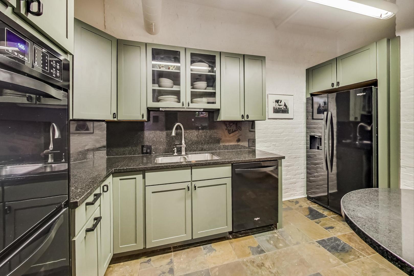1147 West Ohio Street, Unit 201 Chicago, IL 60642 - Photo 5 of 54 a kitchen with a sink stove and refrigerator