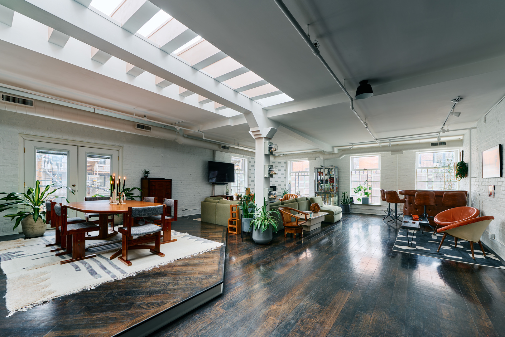 1147 West Ohio Street, Unit 201 Chicago, IL 60642 - Photo 9 of 54 a living room with lots of furniture and wooden floor