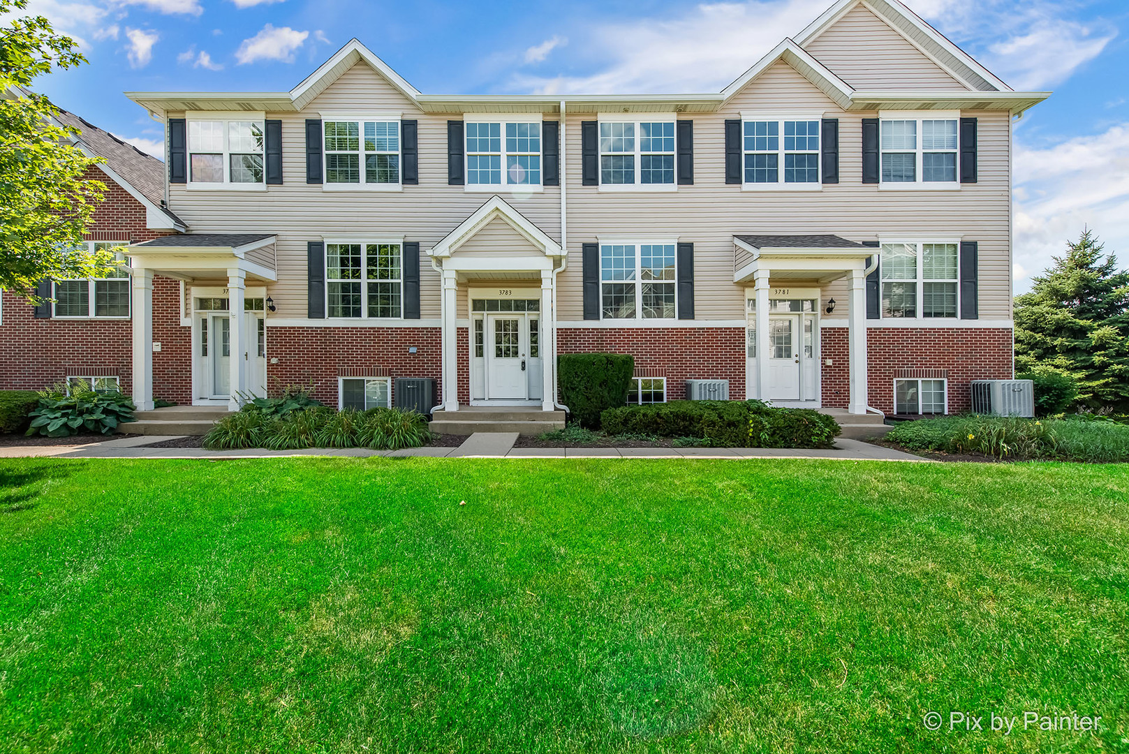front view of a house with a yard