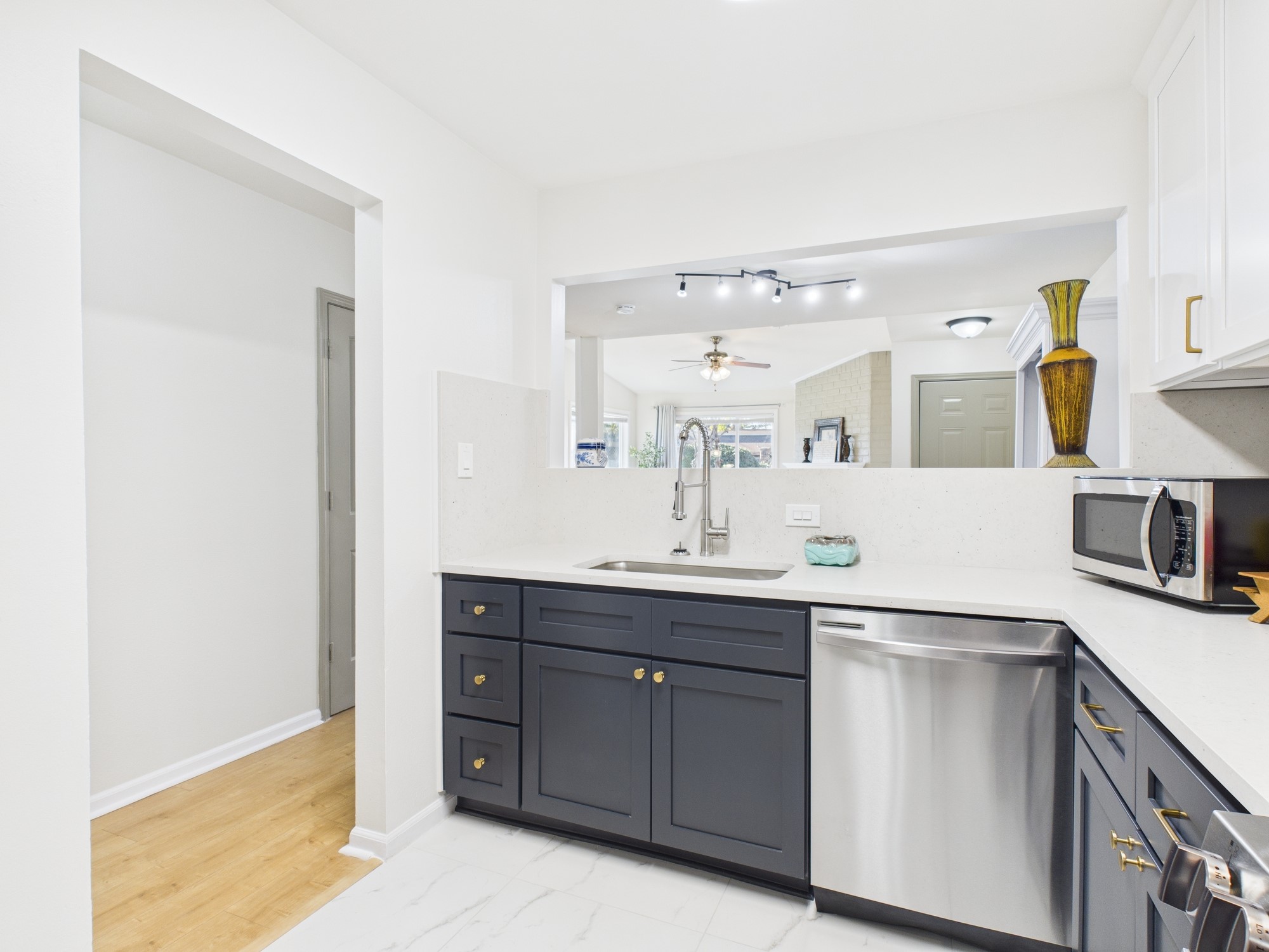 7836 Bateman Lane, Unit 7836 Houston, TX 77088 - Photo 11 of 44 a kitchen with a sink and cabinets