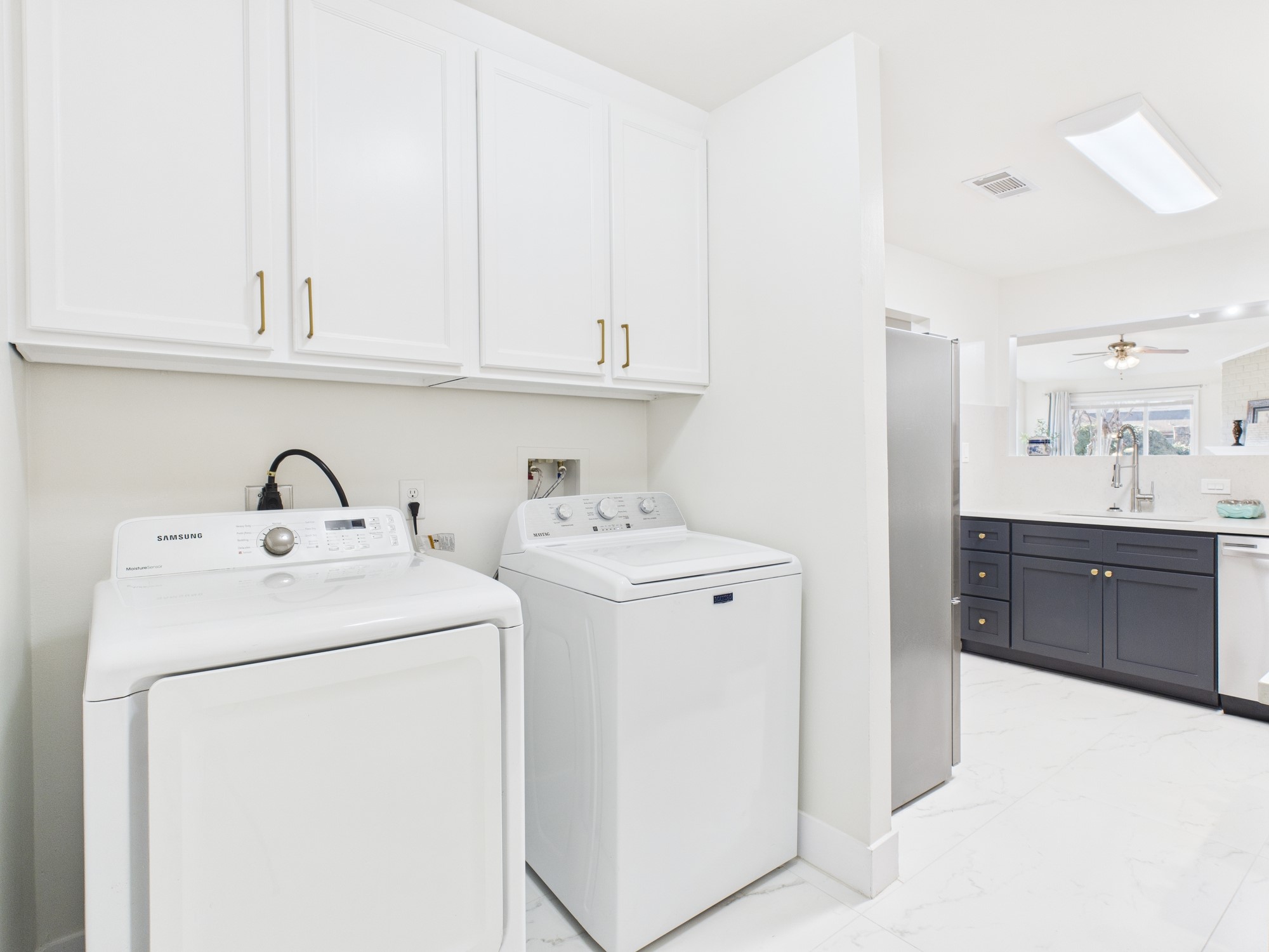 7836 Bateman Lane, Unit 7836 Houston, TX 77088 - Photo 16 of 44 a view of storage and utility room with washer and dryer