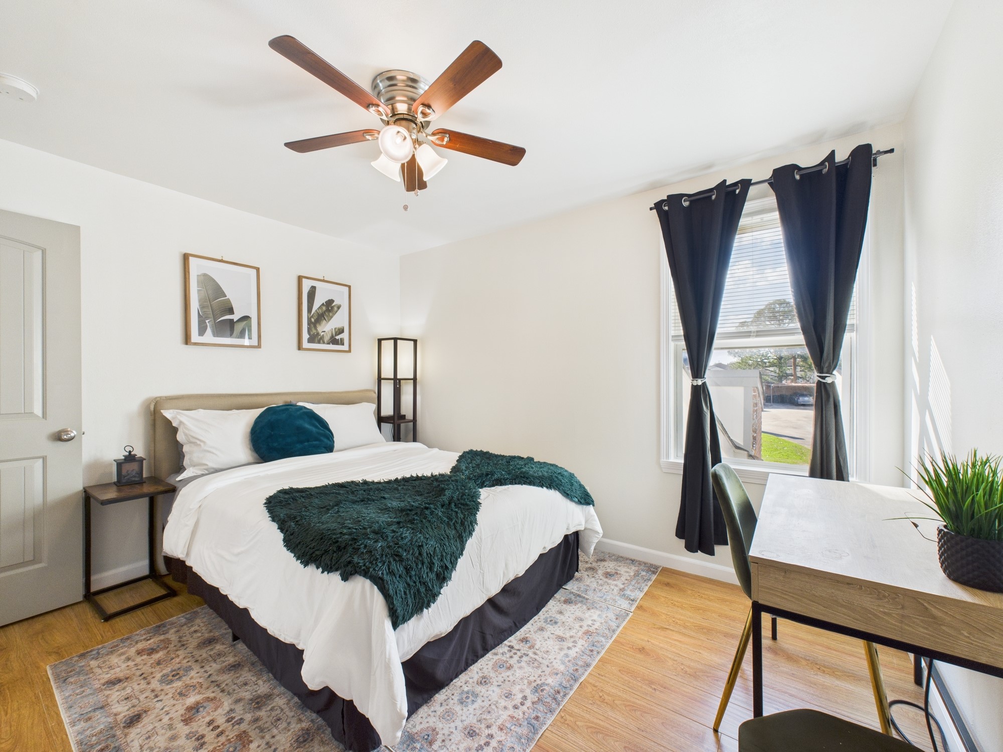 7836 Bateman Lane, Unit 7836 Houston, TX 77088 - Photo 27 of 44 a living room with a bed furniture and a window