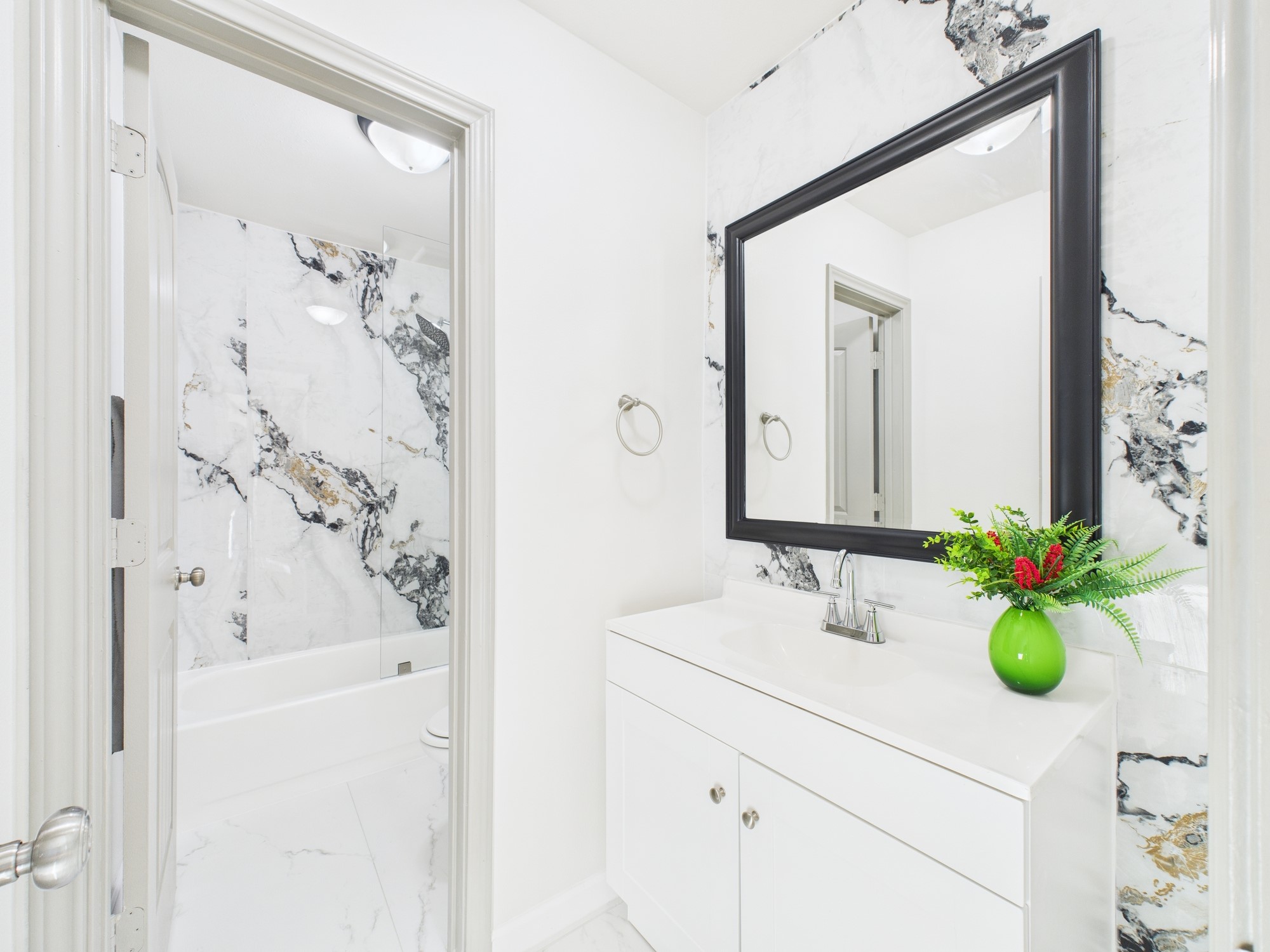 7836 Bateman Lane, Unit 7836 Houston, TX 77088 - Photo 30 of 44 a bathroom with a sink mirror and vanity