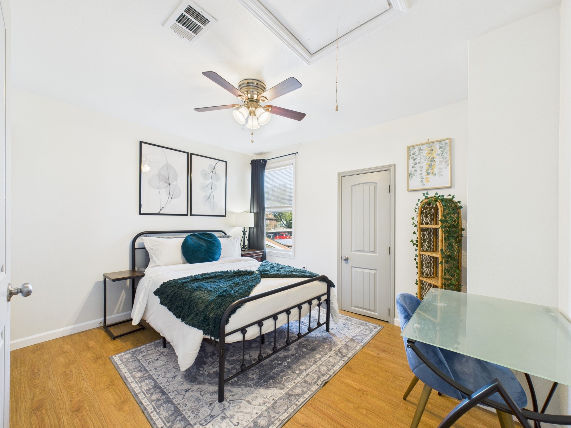 7836 Bateman Lane, Unit 7836 Houston, TX 77088 - Photo 32 of 44 a bedroom with a bed window and a table