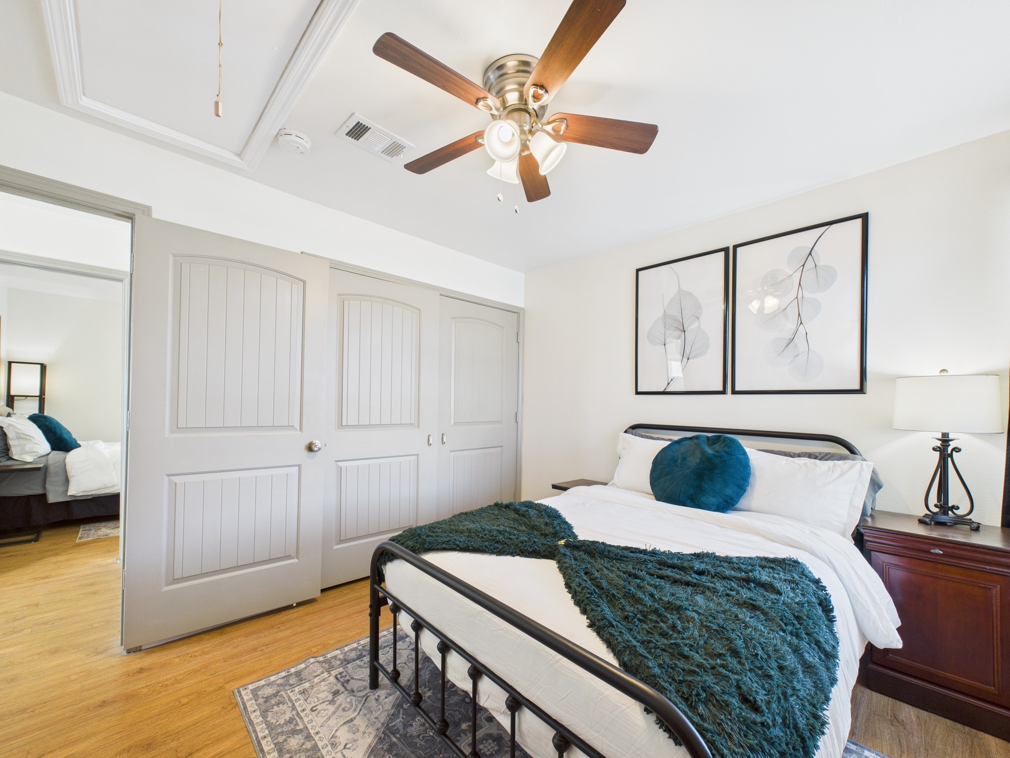 7836 Bateman Lane, Unit 7836 Houston, TX 77088 - Photo 33 of 44 a bedroom with a bed and wooden floor