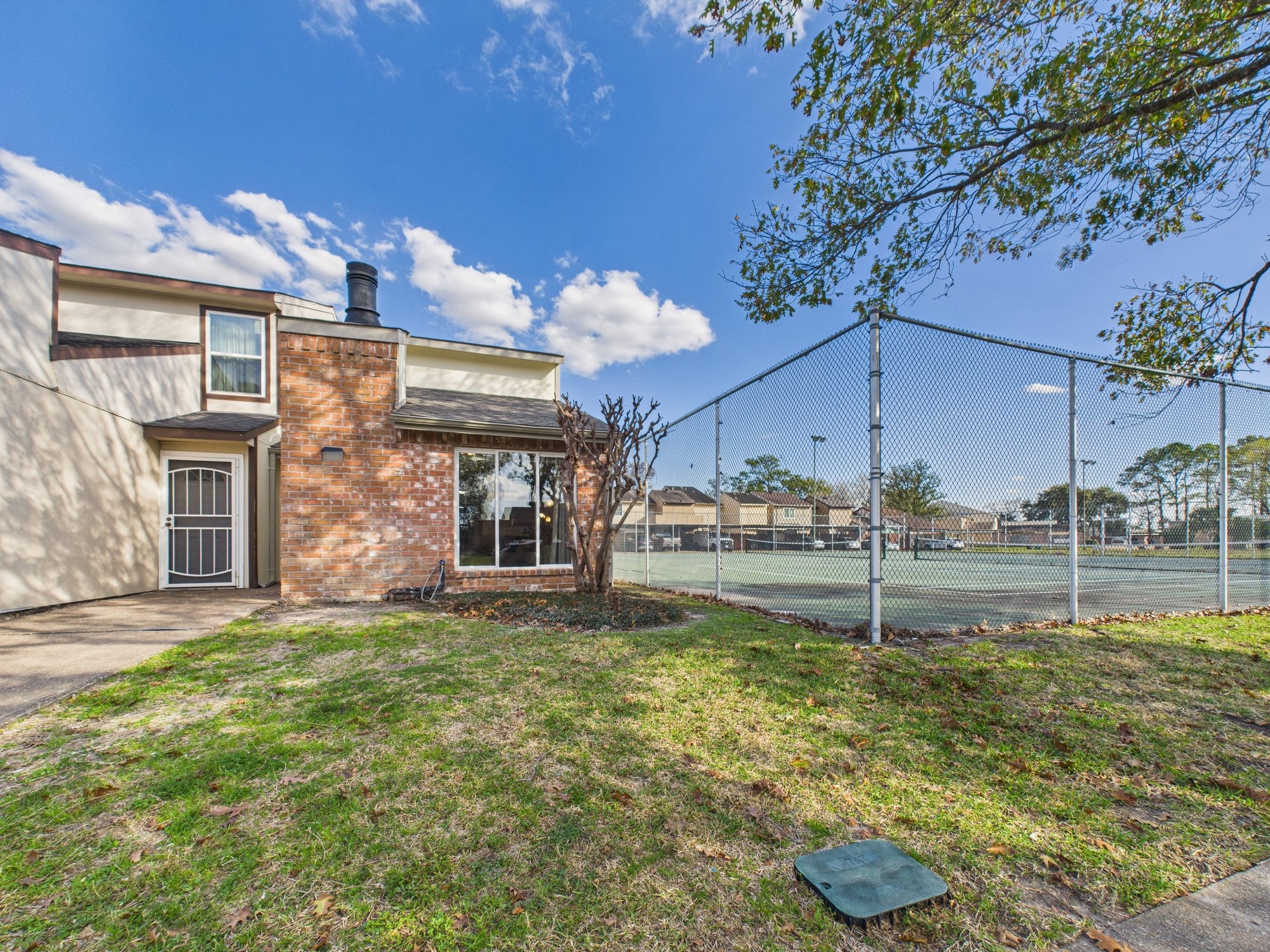 7836 Bateman Lane, Unit 7836 Houston, TX 77088 - Photo 38 of 44 a view of a house with a yard