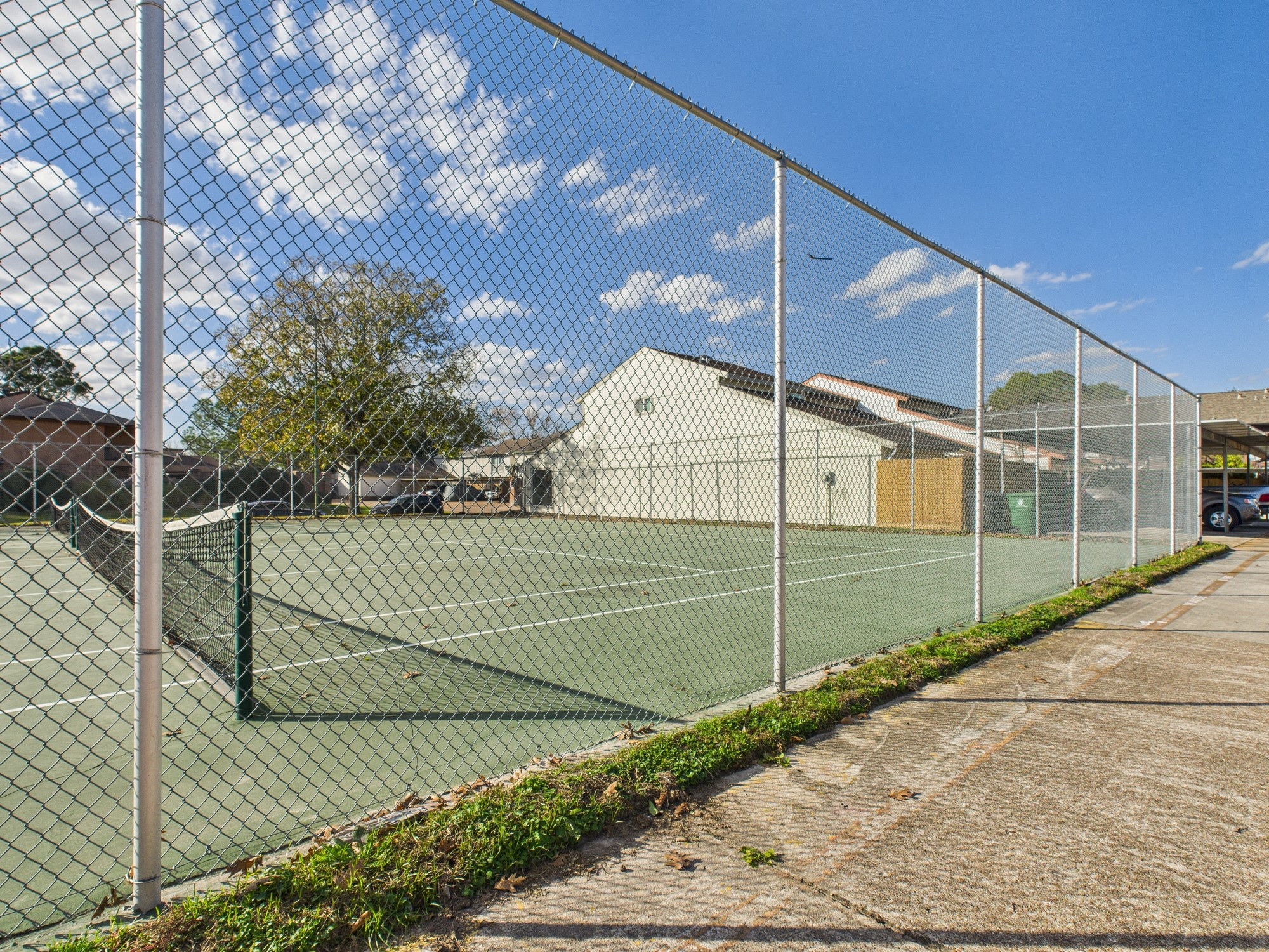 7836 Bateman Lane, Unit 7836 Houston, TX 77088 - Photo 39 of 44 a view of a tennis court