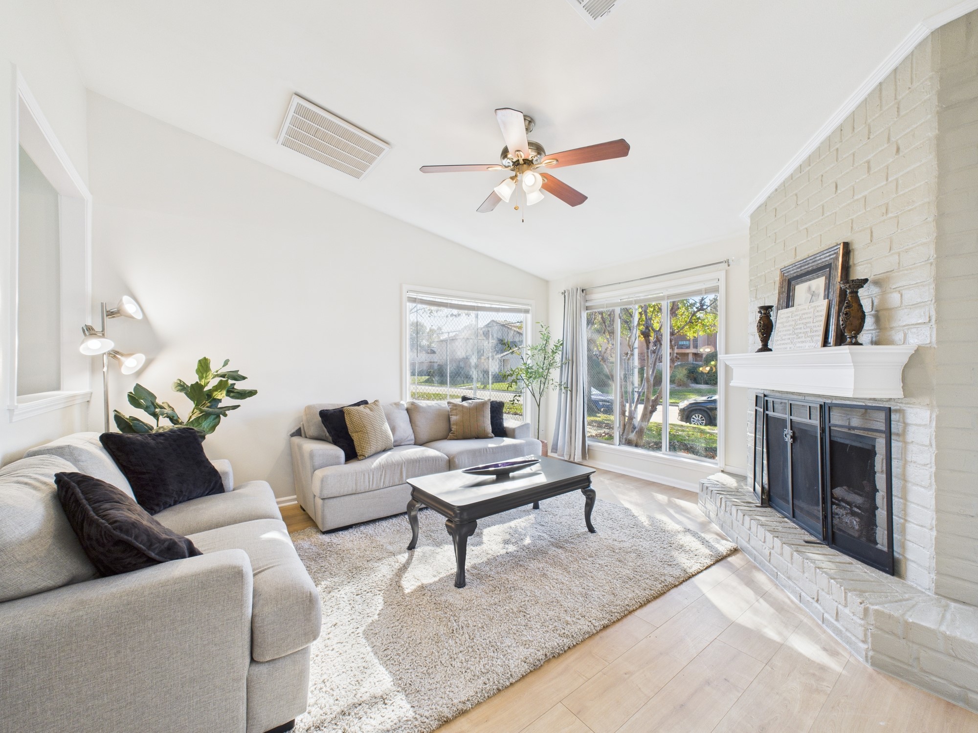 7836 Bateman Lane, Unit 7836 Houston, TX 77088 - Photo 3 of 44 a living room with furniture and a fireplace