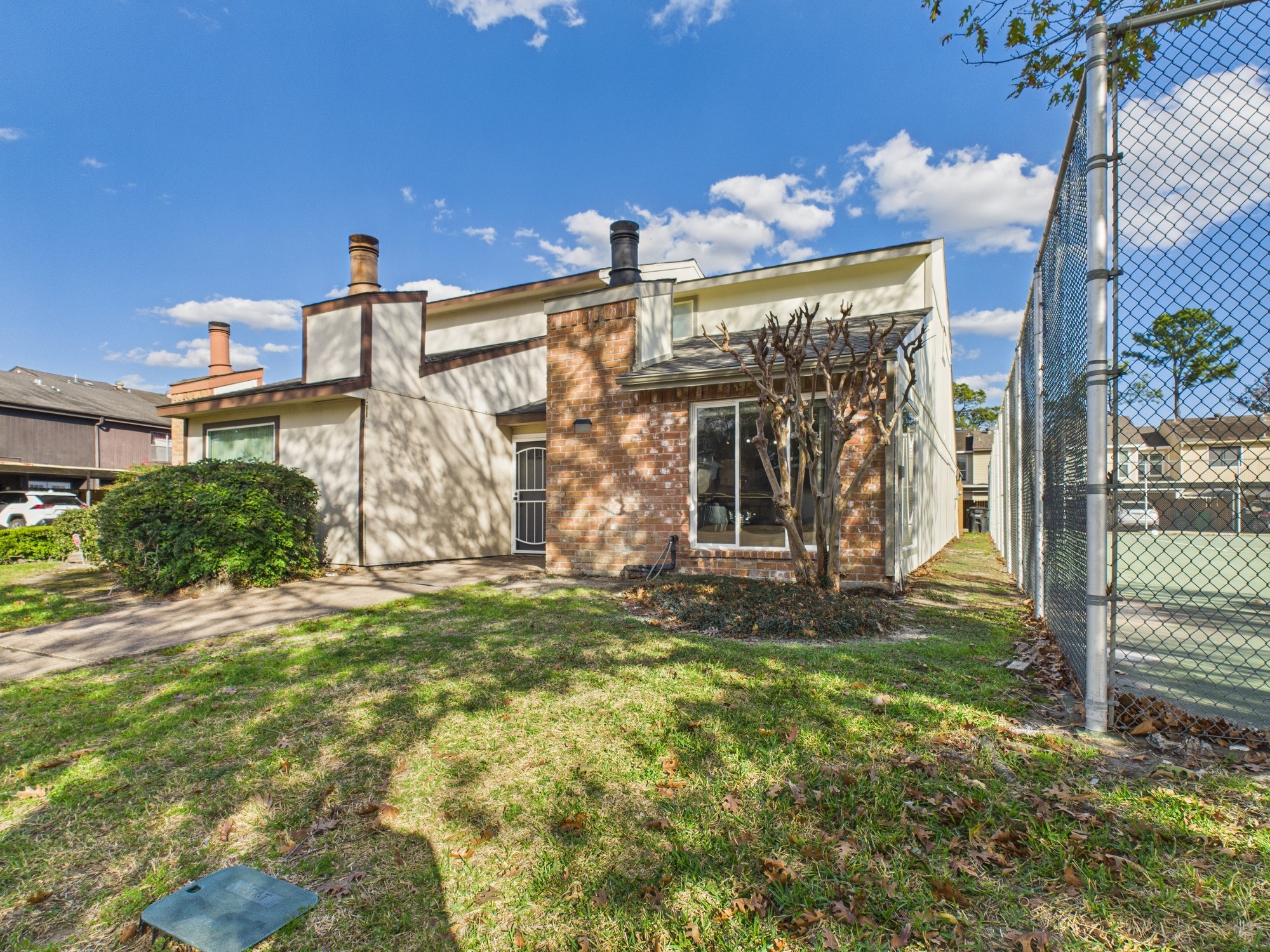 7836 Bateman Lane, Unit 7836 Houston, TX 77088 - Photo 41 of 44 a view of a house with a yard