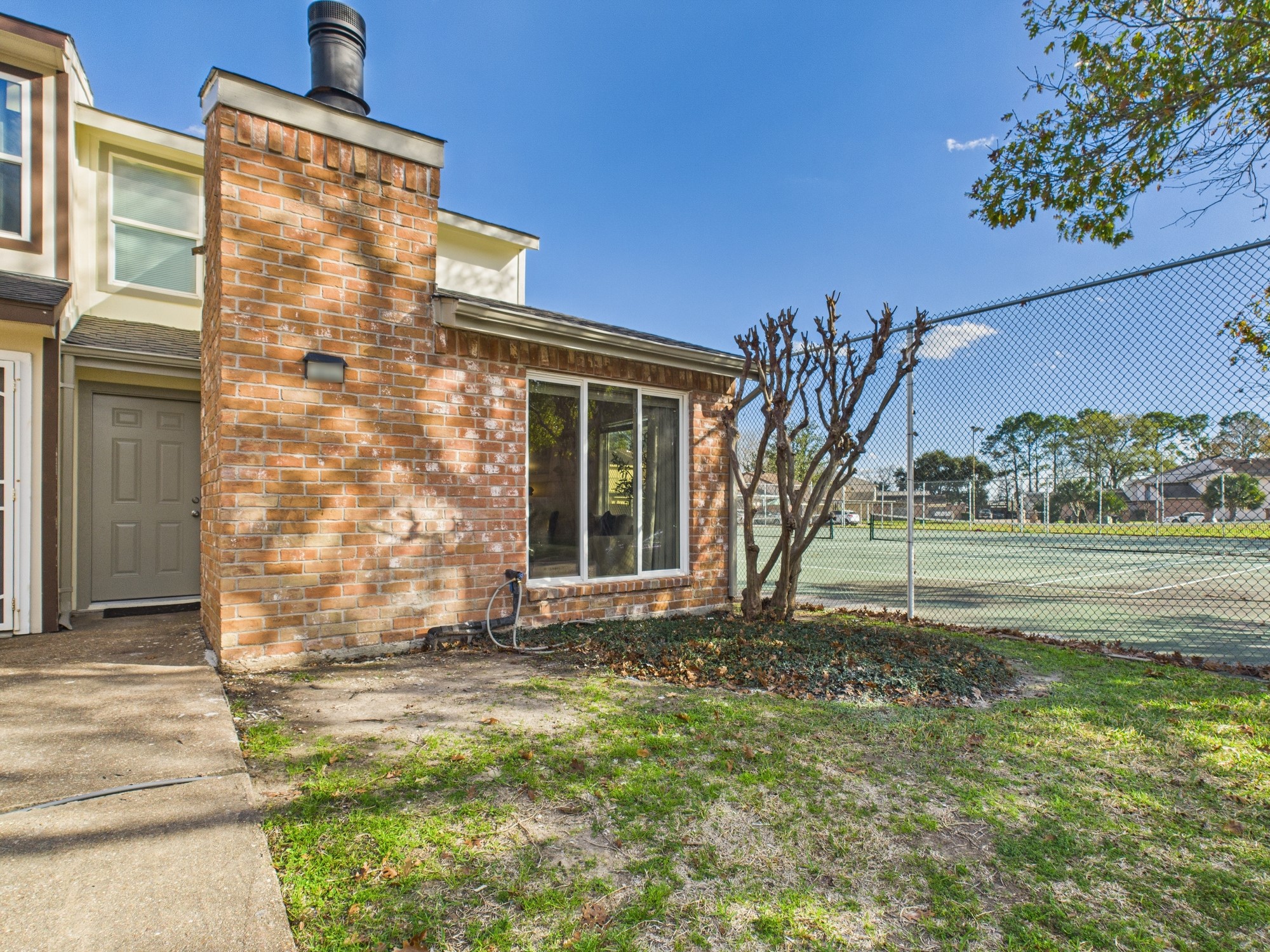 7836 Bateman Lane, Unit 7836 Houston, TX 77088 - Photo 42 of 44 a view of a house with a yard