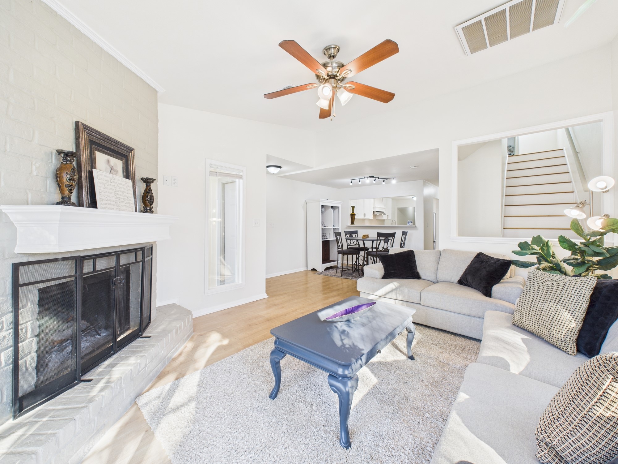 7836 Bateman Lane, Unit 7836 Houston, TX 77088 - Photo 6 of 44 a living room with furniture and a fireplace