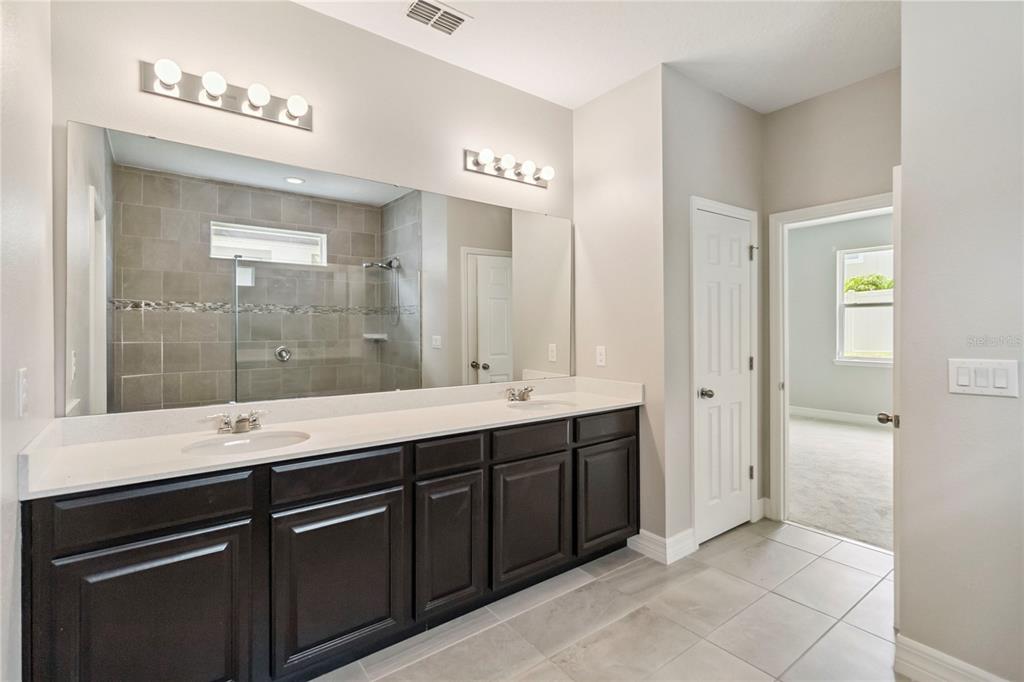 2066 Cresswell Street Ocoee, FL 34761 - Photo 15 of 32 a bathroom with a sink and a mirror