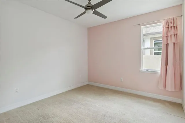 a bathroom with a double vanity sink toilet and a mirror