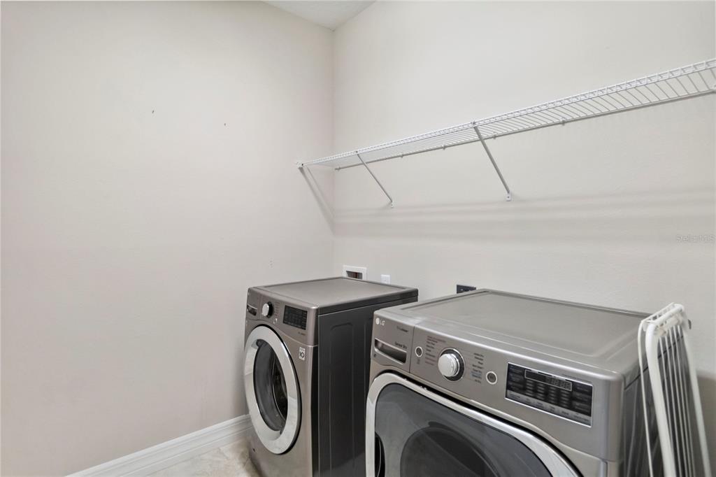 2066 Cresswell Street Ocoee, FL 34761 - Photo 22 of 32 a utility room with dryer and washer