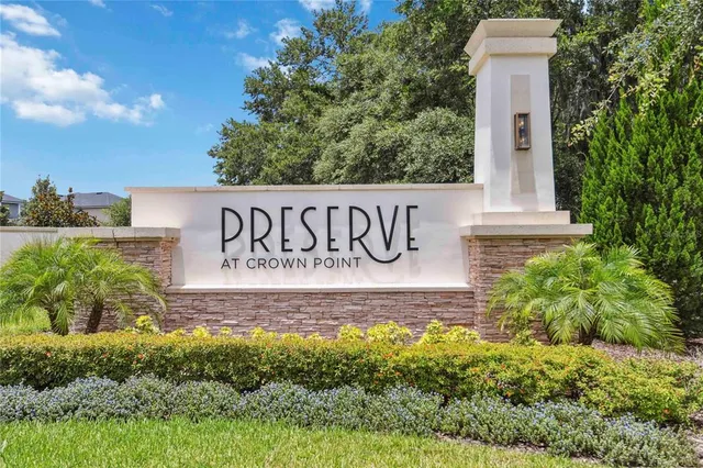 a swimming pool with outdoor seating and yard