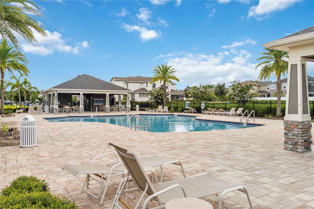 2066 Cresswell Street Ocoee, FL 34761 - Photo 29 of 32 a swimming pool with outdoor seating and yard