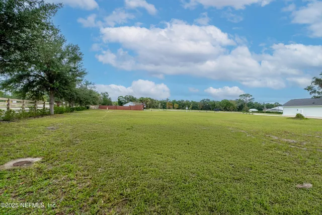 a view of a lake with a yard