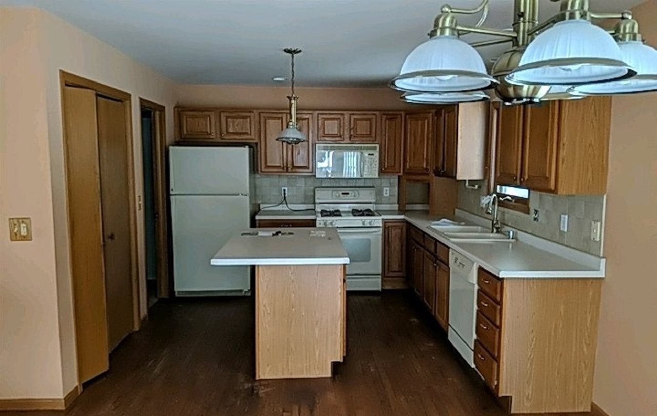 1715 Lake Summerset Road Davis, IL 61019 - Photo 5 of 9 a kitchen with stainless steel appliances a sink a stove a refrigerator and cabinets