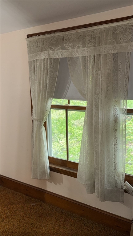 87 Ashfield Road Conway, MA 01341 - Photo 33 of 38 a room with a window and a wooden floor