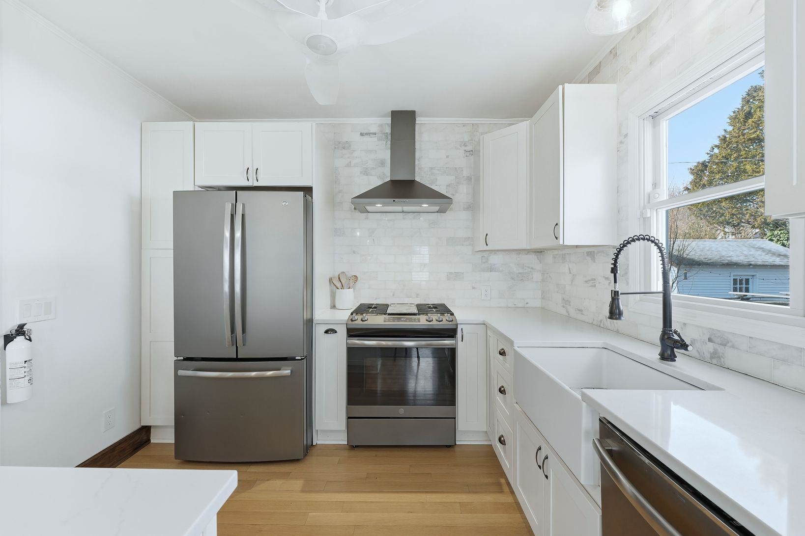 32 Dodd Street Montclair, NJ 07042 - Photo 20 of 36 a kitchen with stainless steel appliances a sink stove and refrigerator