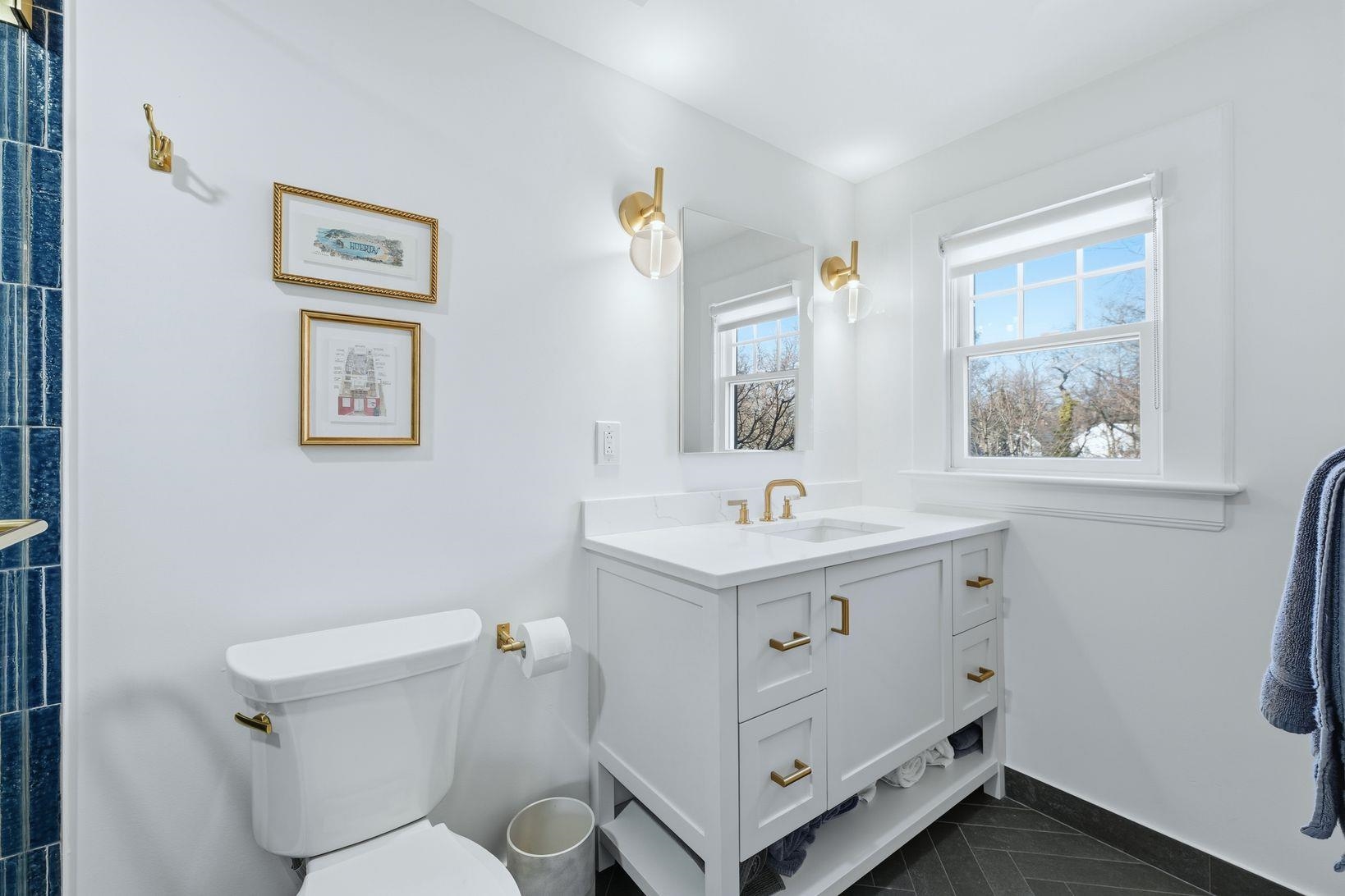 32 Dodd Street Montclair, NJ 07042 - Photo 23 of 36 a bathroom with a toilet a sink and mirror