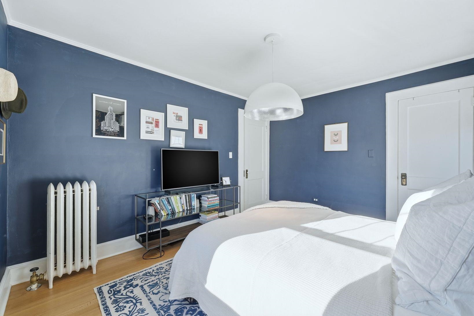 32 Dodd Street Montclair, NJ 07042 - Photo 26 of 36 a bedroom with a bed and a flat screen tv