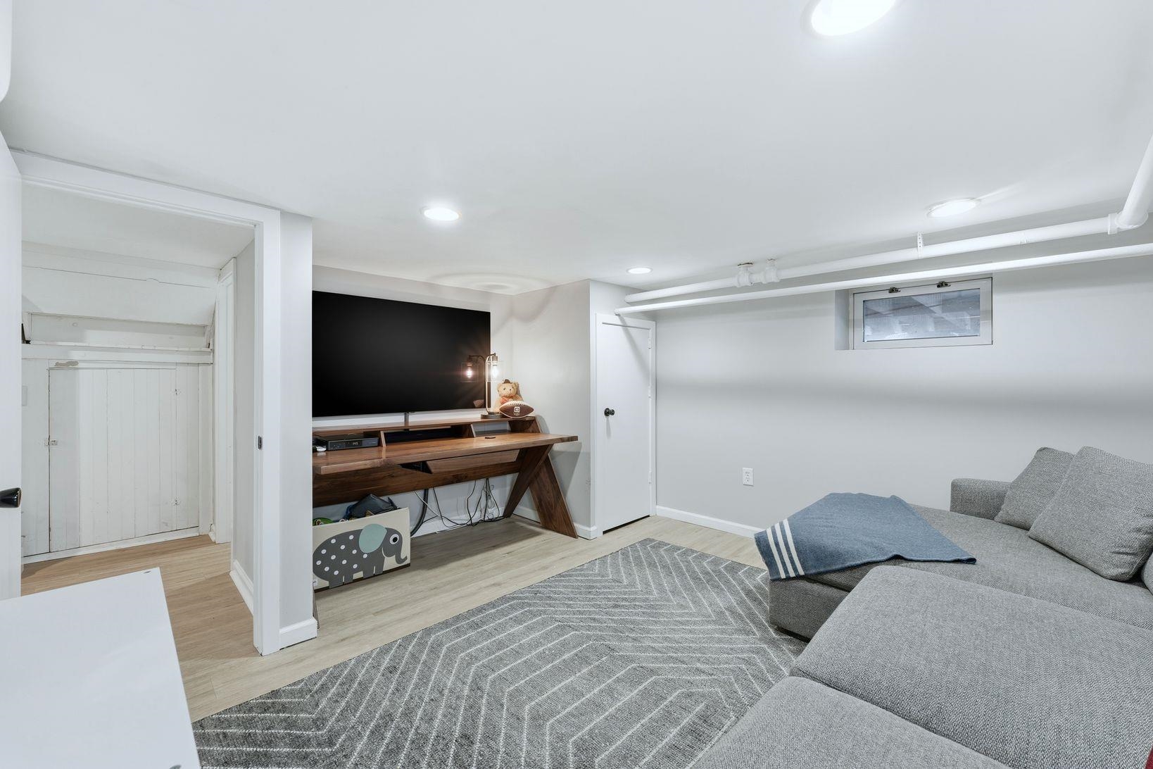 32 Dodd Street Montclair, NJ 07042 - Photo 33 of 36 a living room with furniture and a flat screen tv