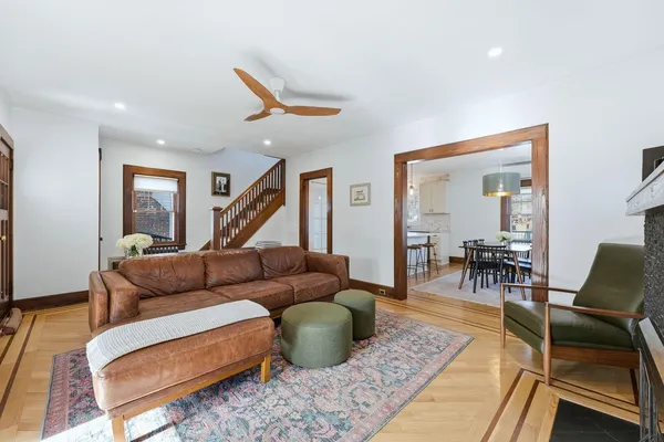 a view of a dining room with furniture and wooden floor
