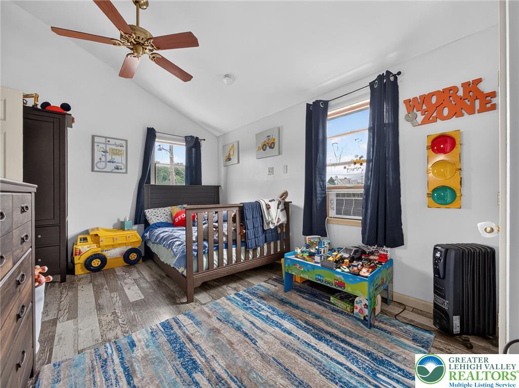 2628 Levans Road Coplay, PA 18037 - Photo 35 of 54 Sloped ceilings and hardwood flooring complement this well-lit room.