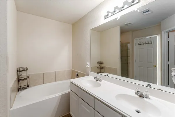 a bathroom with a sink and a bathtub