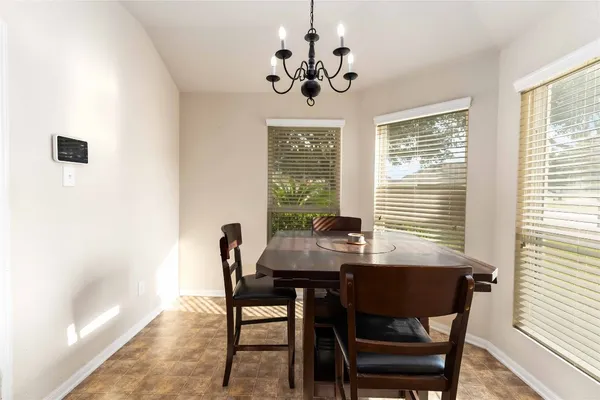 a view of a dining room with furniture window and outside view