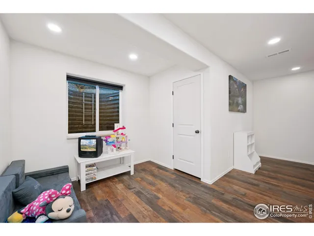 a bedroom with furniture and window