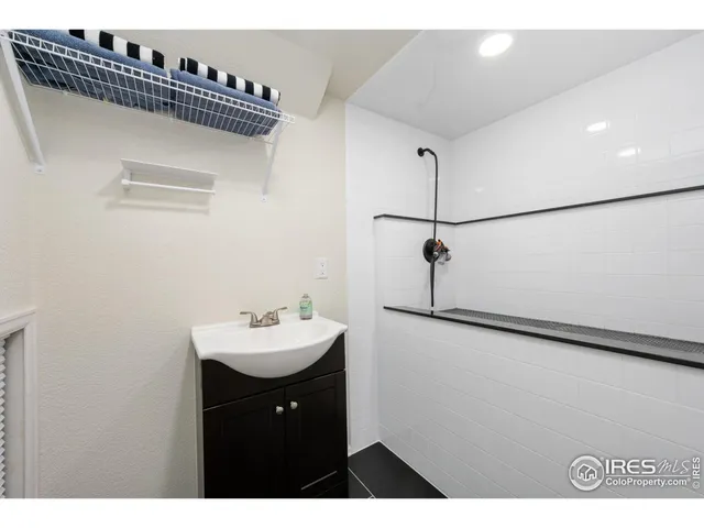 a bathroom with a sink and mirror