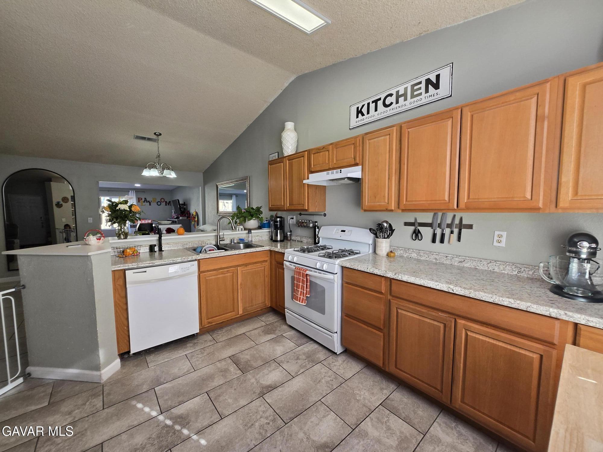3840 Hatcher Place Rosamond, CA 93560 - Photo 11 of 28 a kitchen with sink cabinets and window