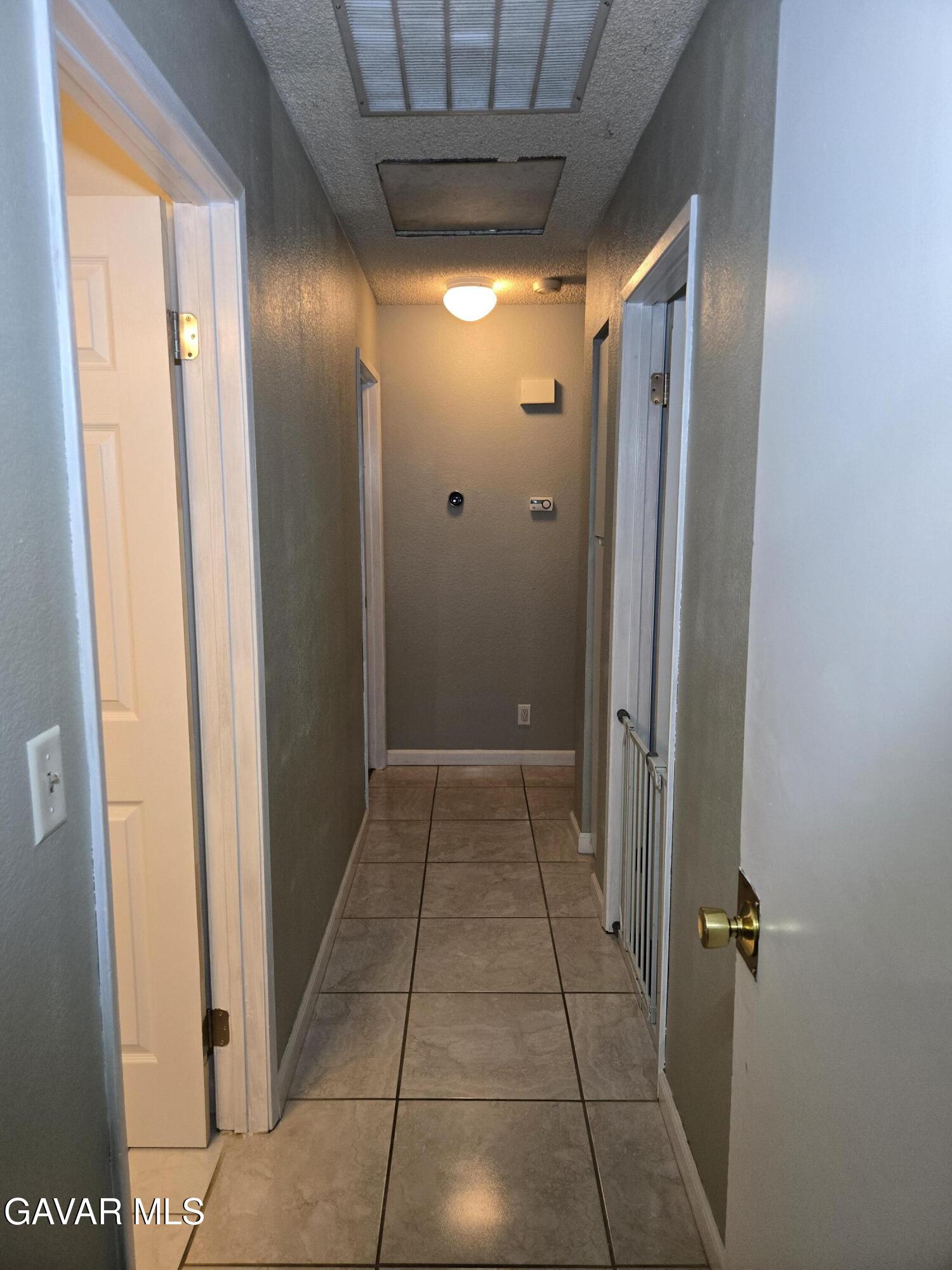 3840 Hatcher Place Rosamond, CA 93560 - Photo 18 of 28 a bathroom with a glass door shower