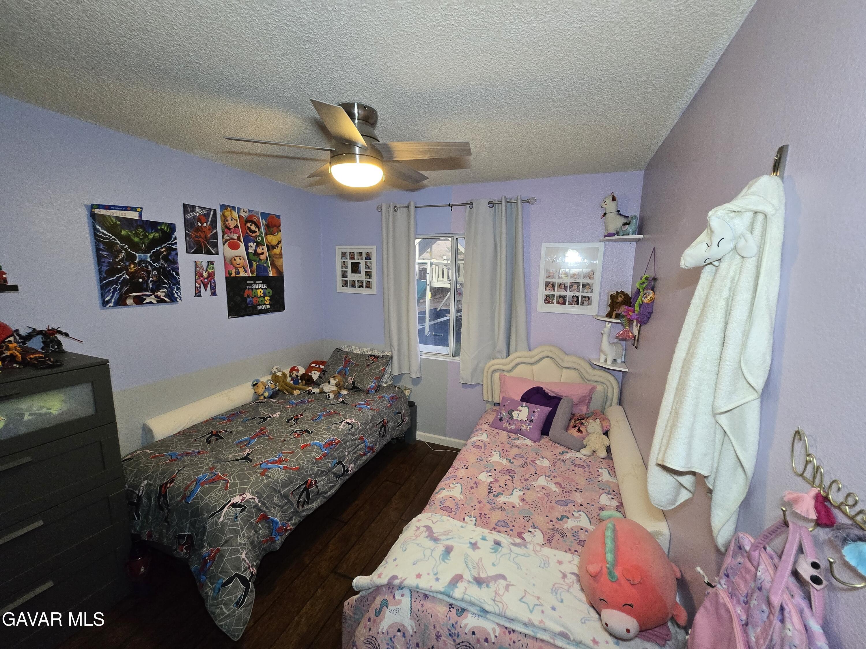 3840 Hatcher Place Rosamond, CA 93560 - Photo 25 of 28 a bedroom with bed and a mirror