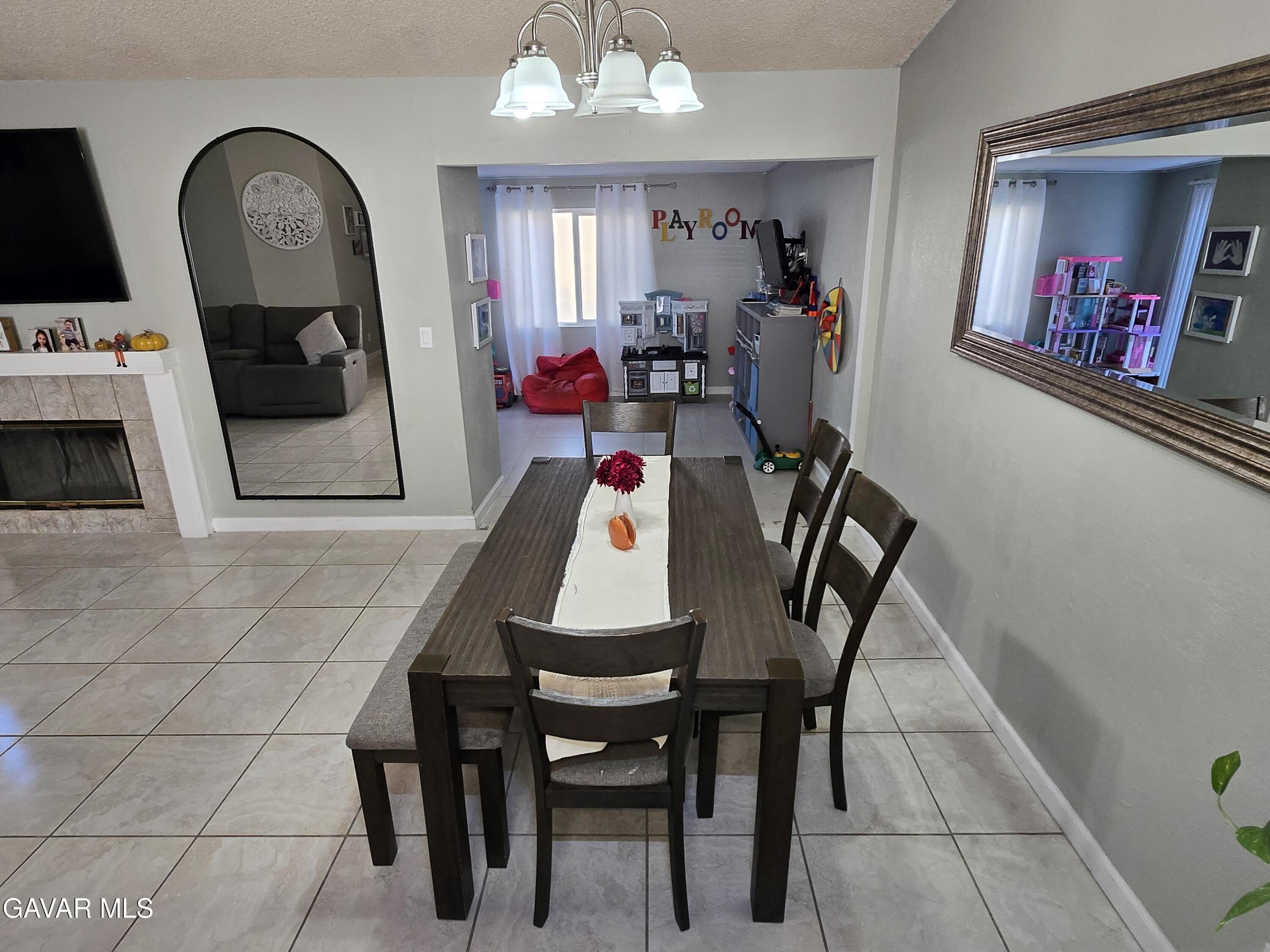 3840 Hatcher Place Rosamond, CA 93560 - Photo 6 of 28 a dining room with furniture and window
