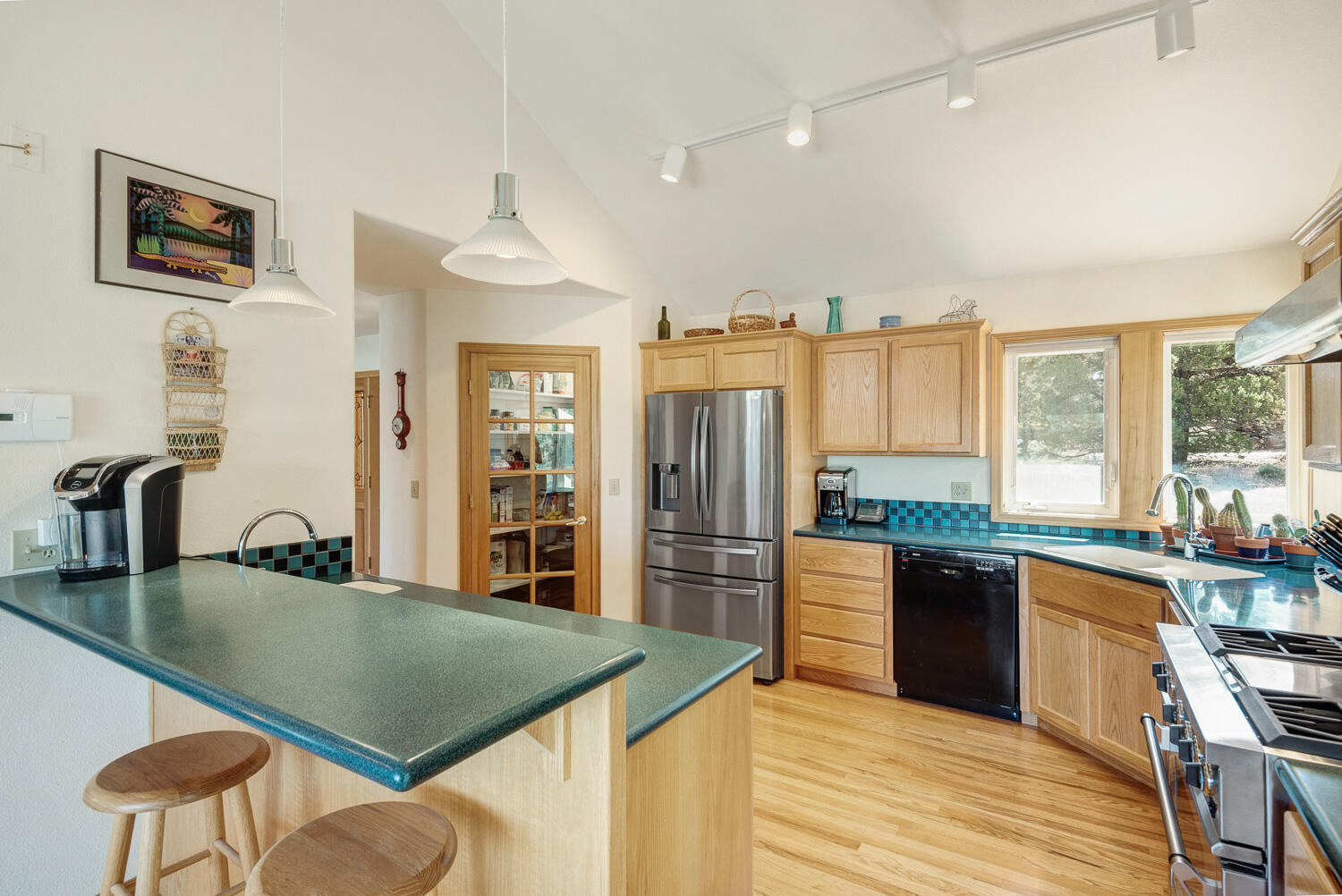 65230 Smokey Ridge Road Bend, OR 97703 - Photo 21 of 53 Kitchen w/ pantry and newer refrigerator