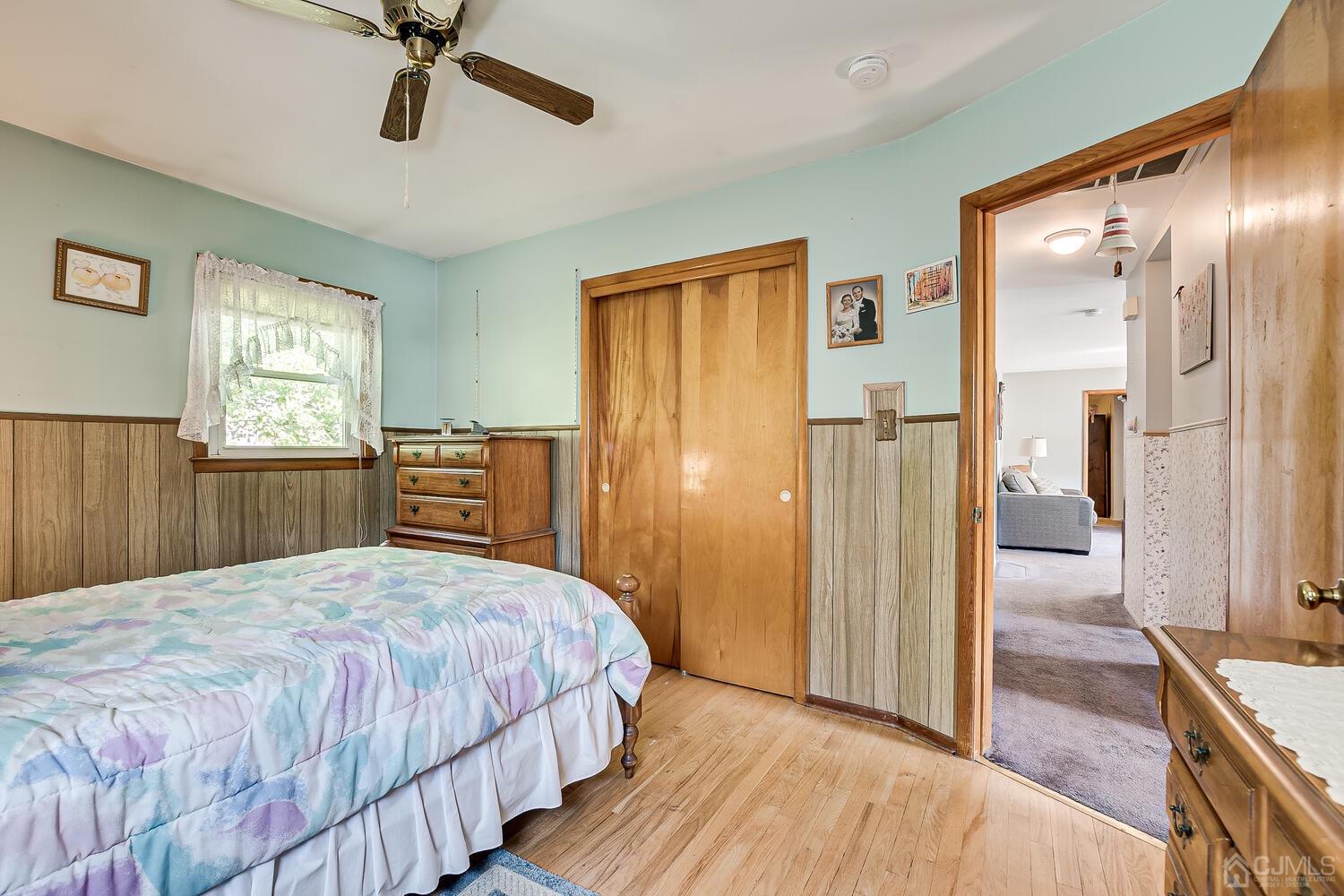 238 Suttons Lane Edison, NJ 08817 - Photo 12 of 21 a bedroom with a bed and wooden floor