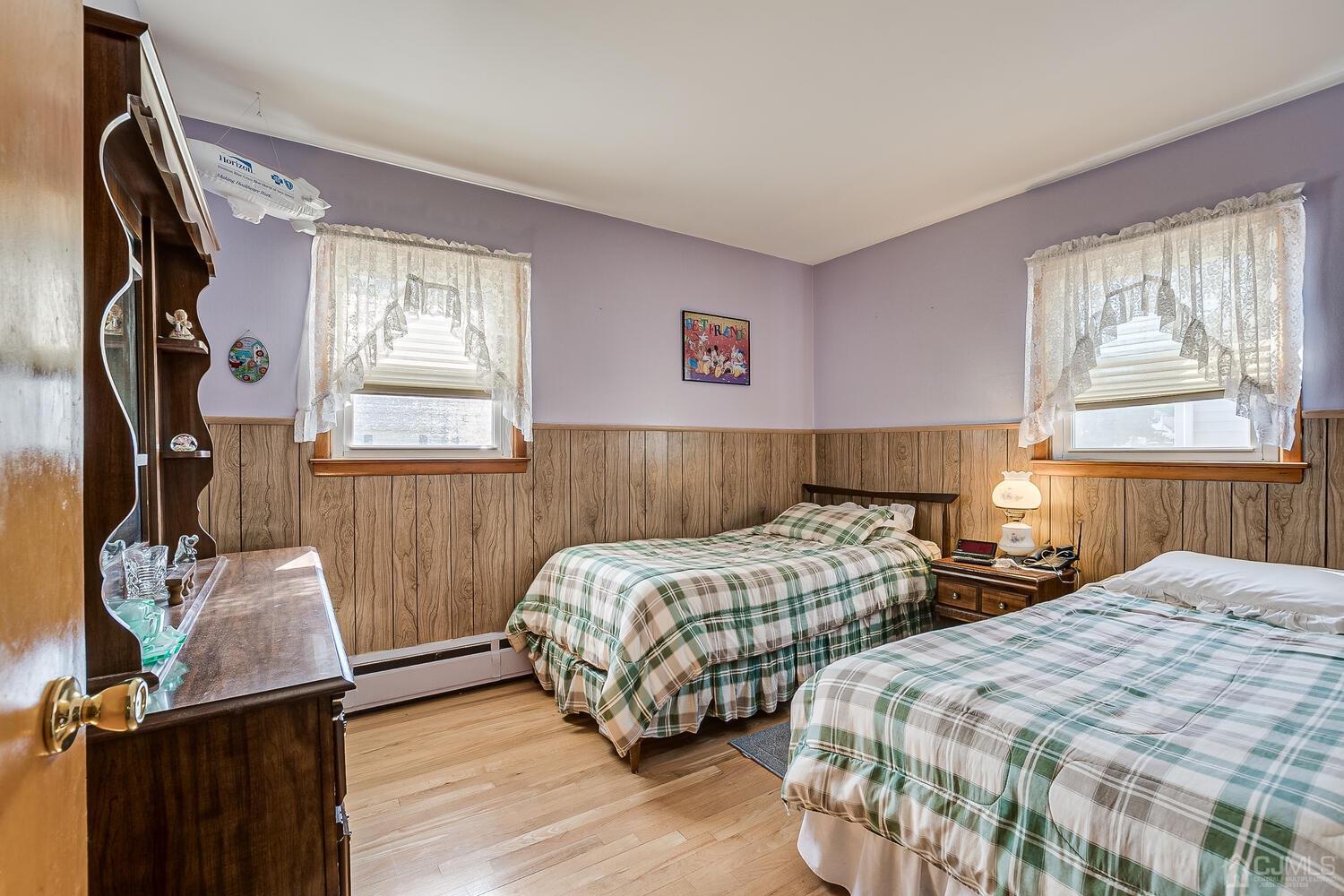 238 Suttons Lane Edison, NJ 08817 - Photo 13 of 21 a bedroom with two beds and wooden floor