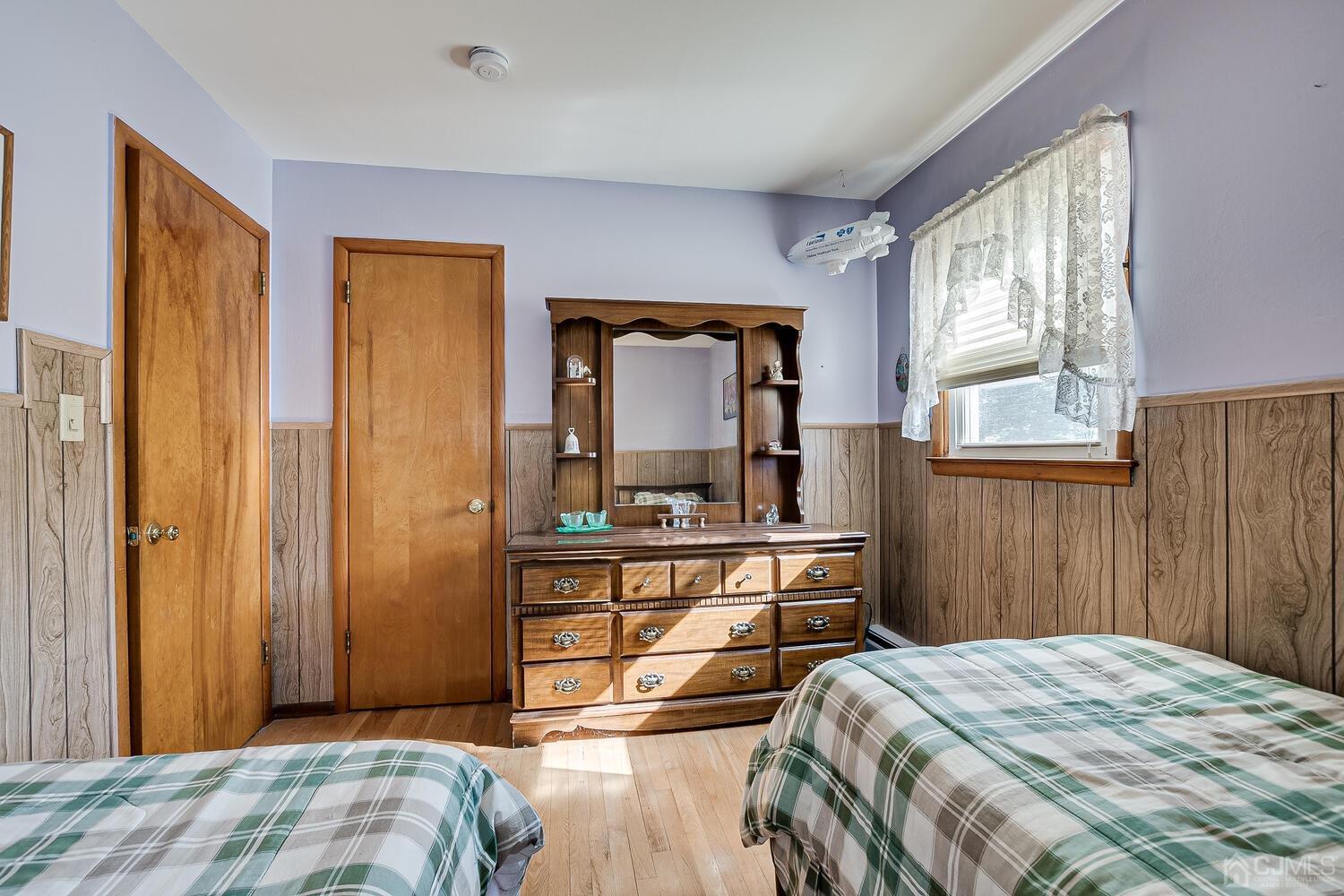 238 Suttons Lane Edison, NJ 08817 - Photo 14 of 21 a bedroom with a bed and a dresser