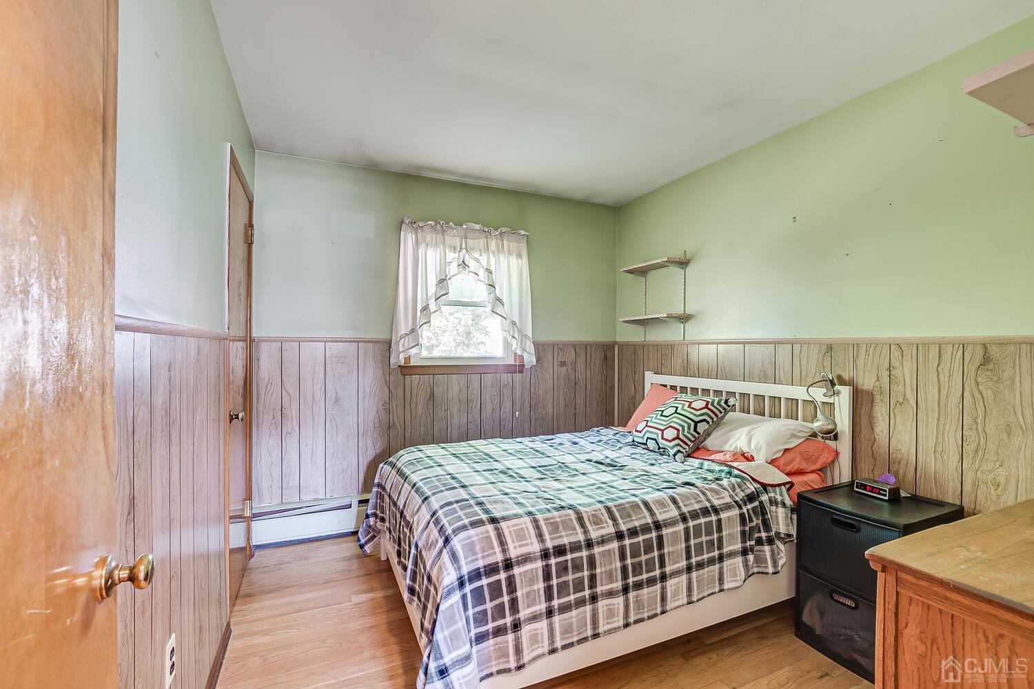 238 Suttons Lane Edison, NJ 08817 - Photo 15 of 21 a bedroom with a bed and a window