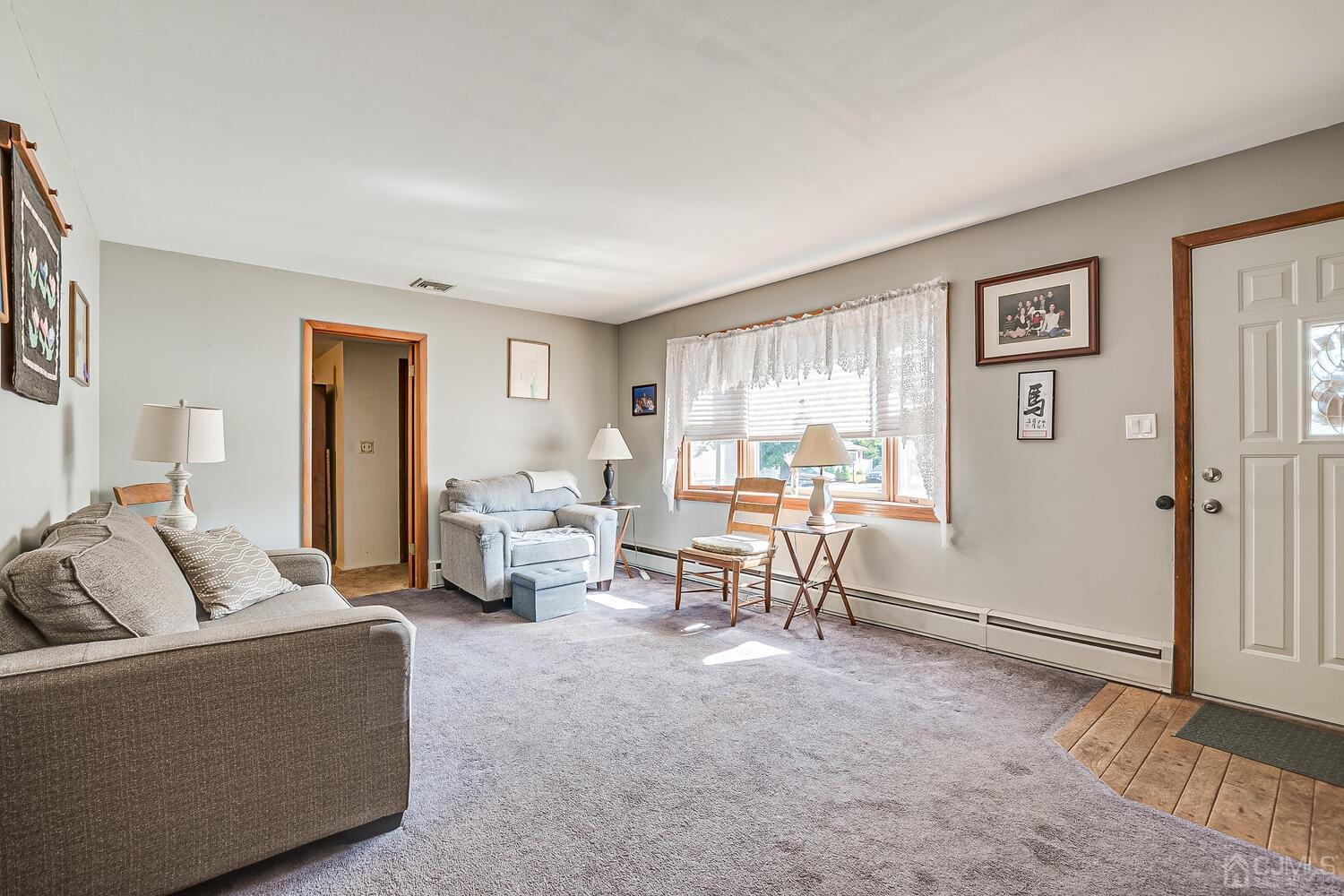238 Suttons Lane Edison, NJ 08817 - Photo 4 of 21 a living room with furniture and a window