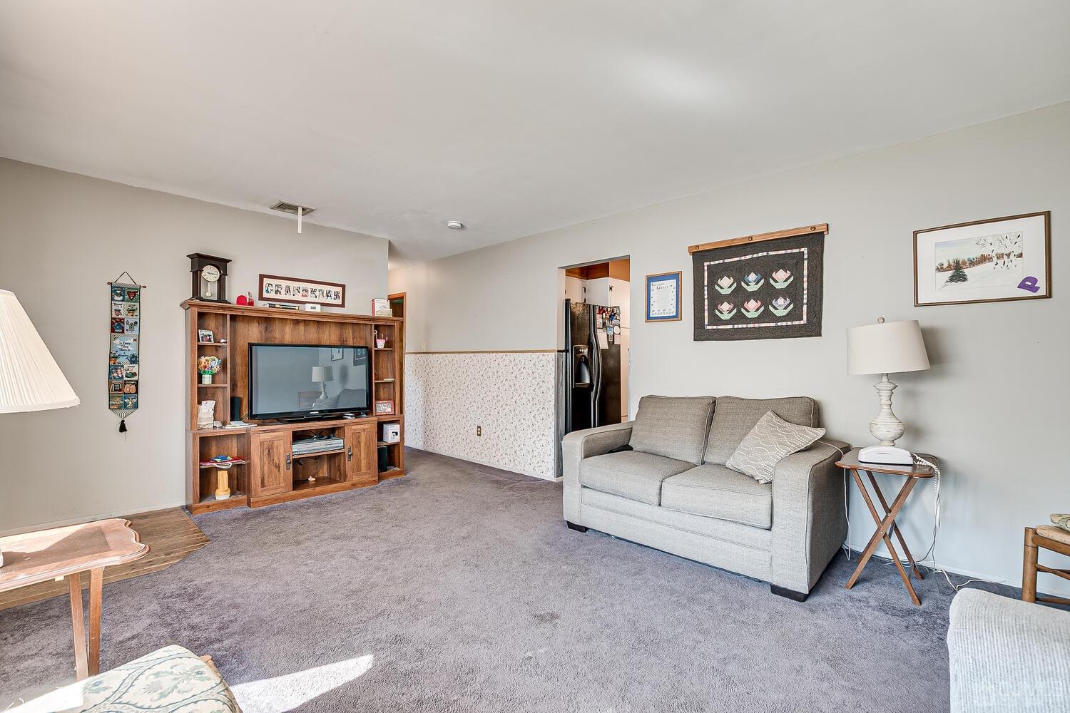 238 Suttons Lane Edison, NJ 08817 - Photo 5 of 21 a living room with furniture and a flat screen tv