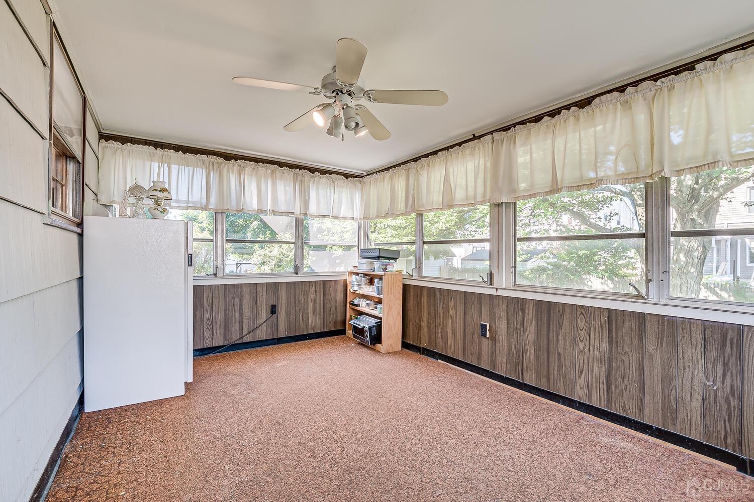 238 Suttons Lane Edison, NJ 08817 - Photo 7 of 21 a kitchen with stainless steel appliances a large counter top a sink cabinets and wooden floor