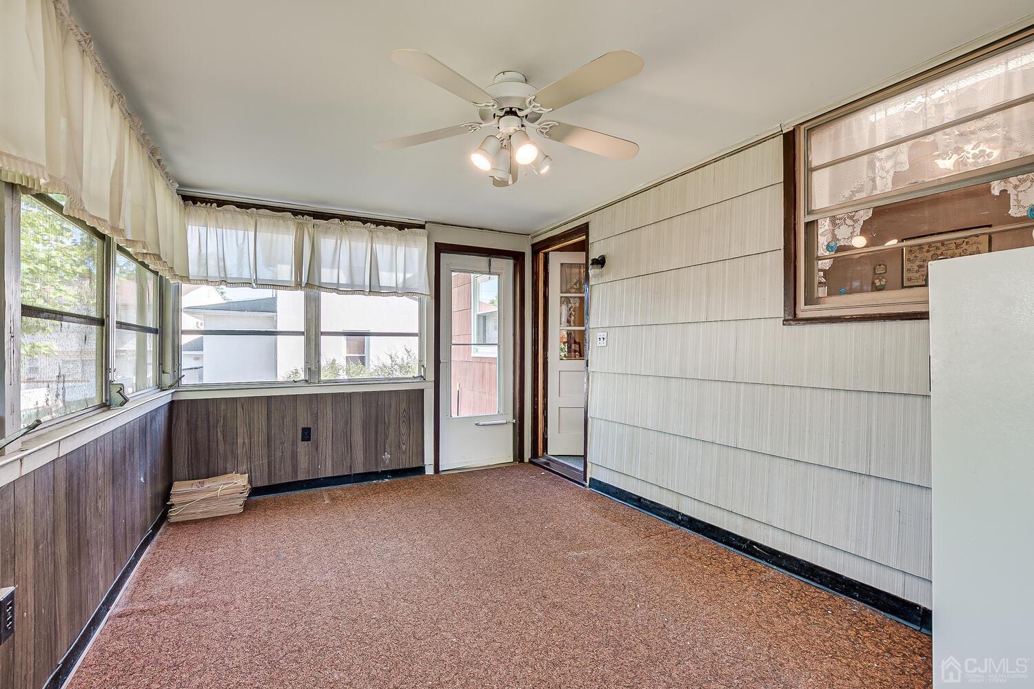 238 Suttons Lane Edison, NJ 08817 - Photo 8 of 21 a view of an empty room with a window
