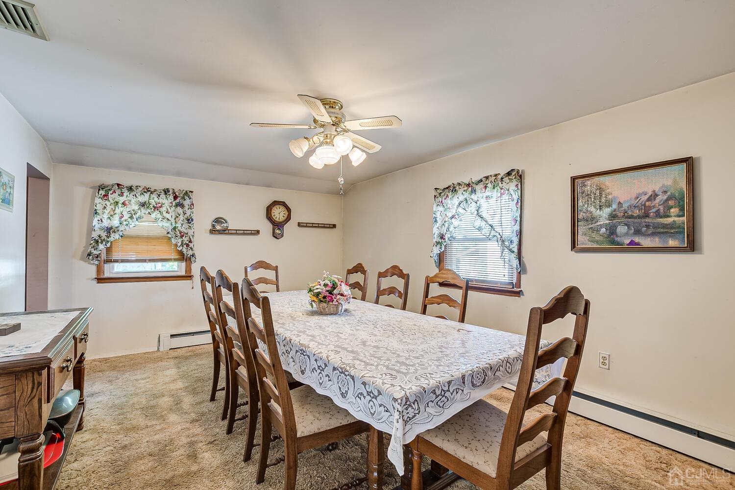 238 Suttons Lane Edison, NJ 08817 - Photo 10 of 21 a view of a dining room with furniture and chandelier
