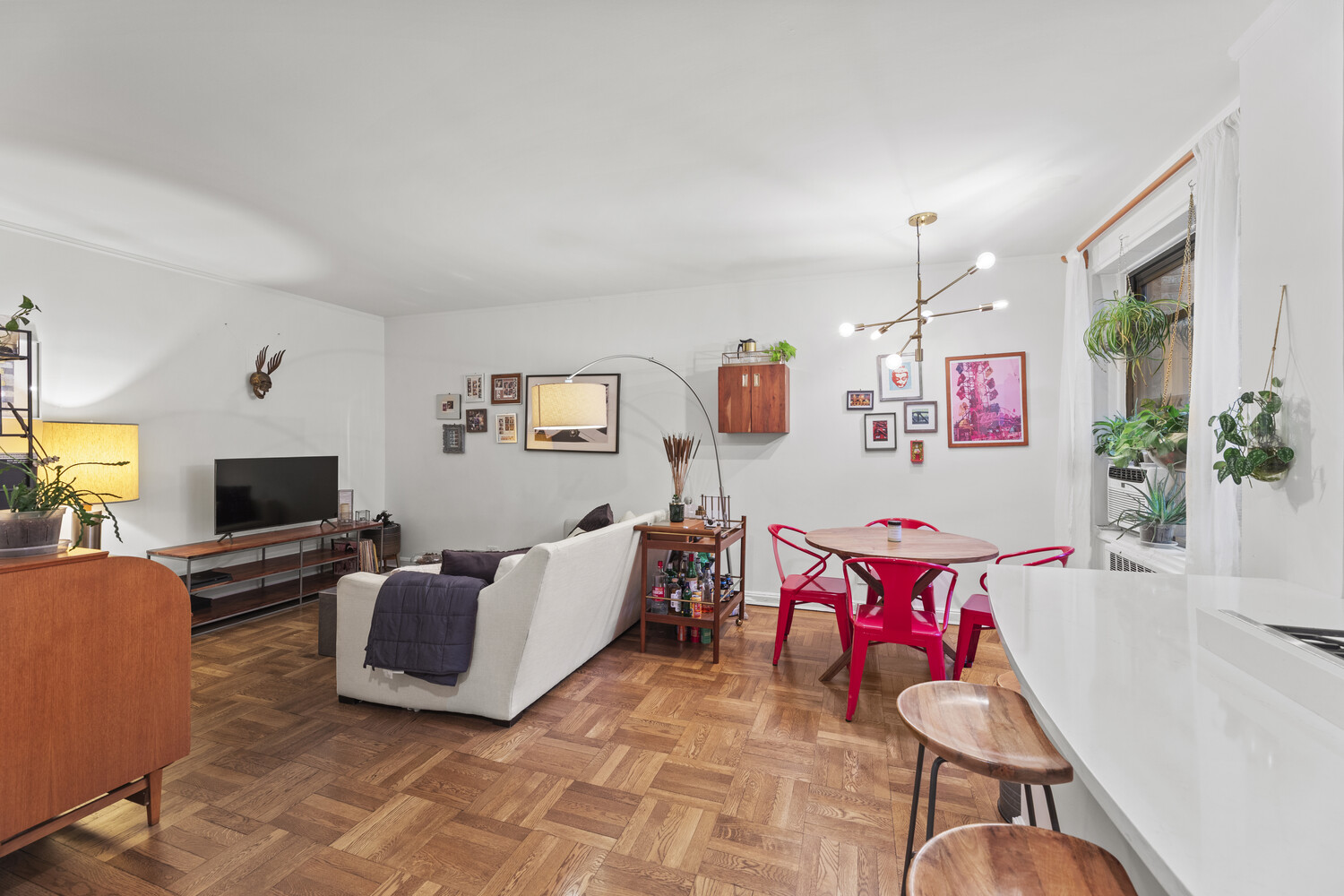 a living room with furniture and flat screen tv