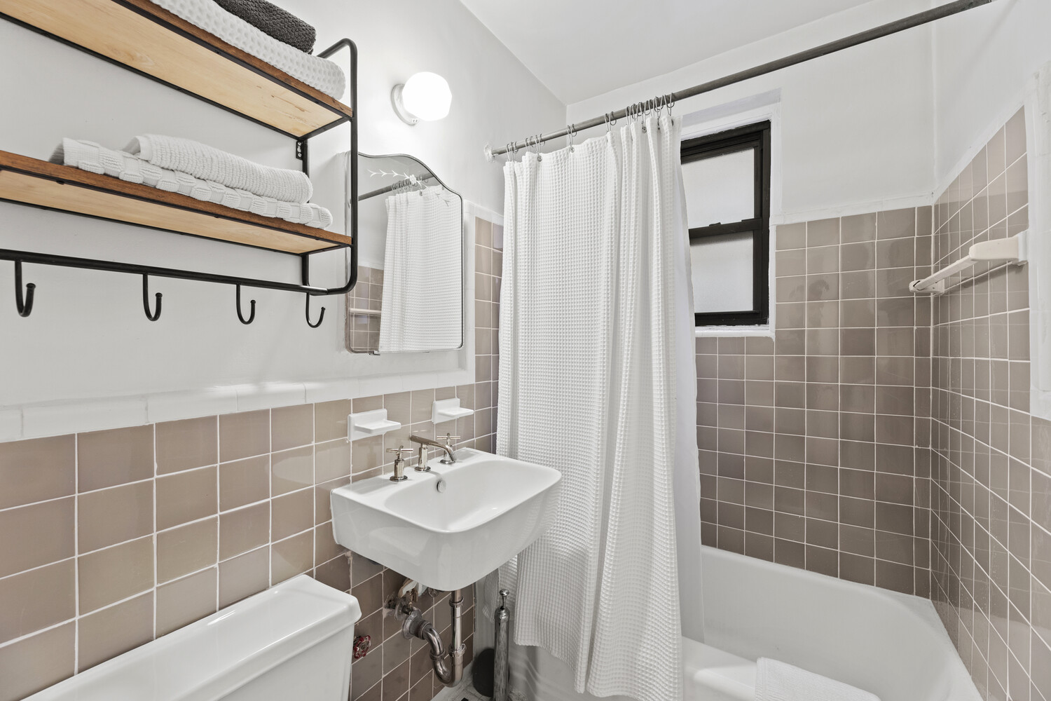 345 Riverside Drive, Unit 4F Manhattan, NY 10025 - Photo 6 of 9 a bathroom with a sink a toilet and shower