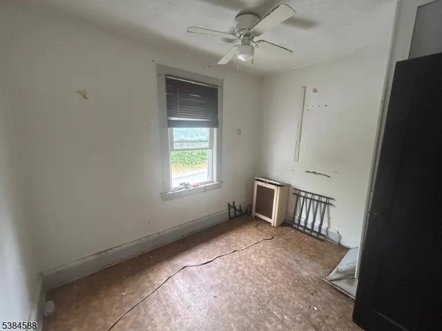 a house view with a sitting space fire pit and outdoor space